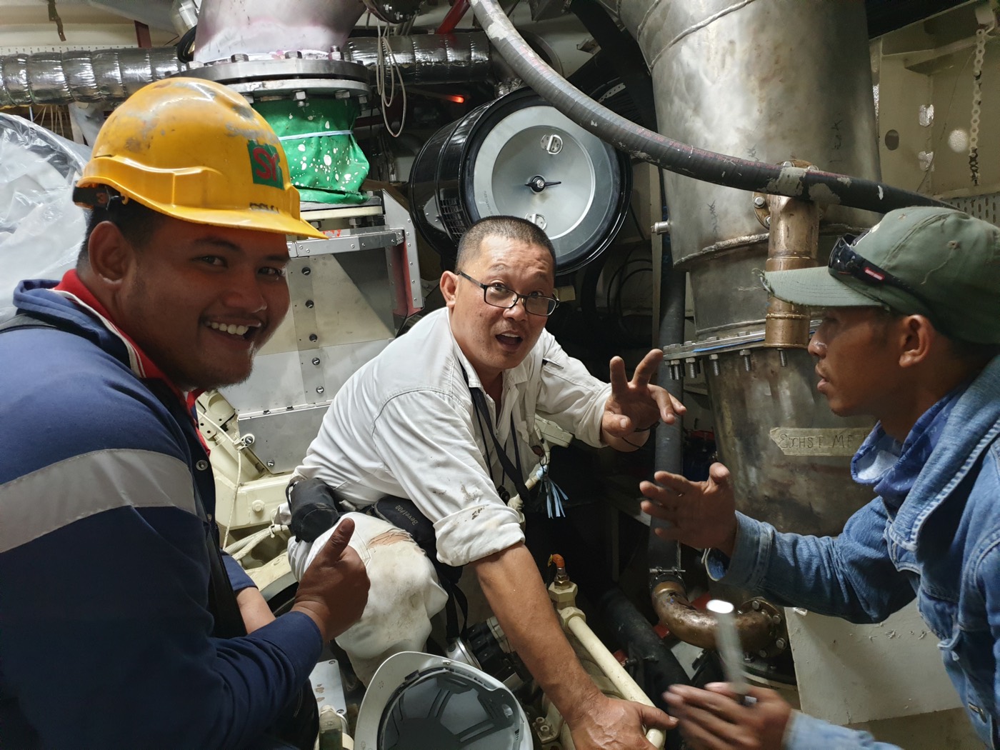 Suh Wan-Chul coaching fitters in the engine room